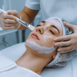 Practitioner applying LHA-based Reboot Peel solution to client's skin at Yeppeun Skin Clinic, a DHA-licensed Korean-standard aesthetic clinic in Jumeirah 2, Dubai