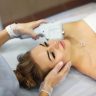 Woman receiving non-surgical V-Lifting HIFU skin tightening treatment for jawline and neck at a Dubai clinic
